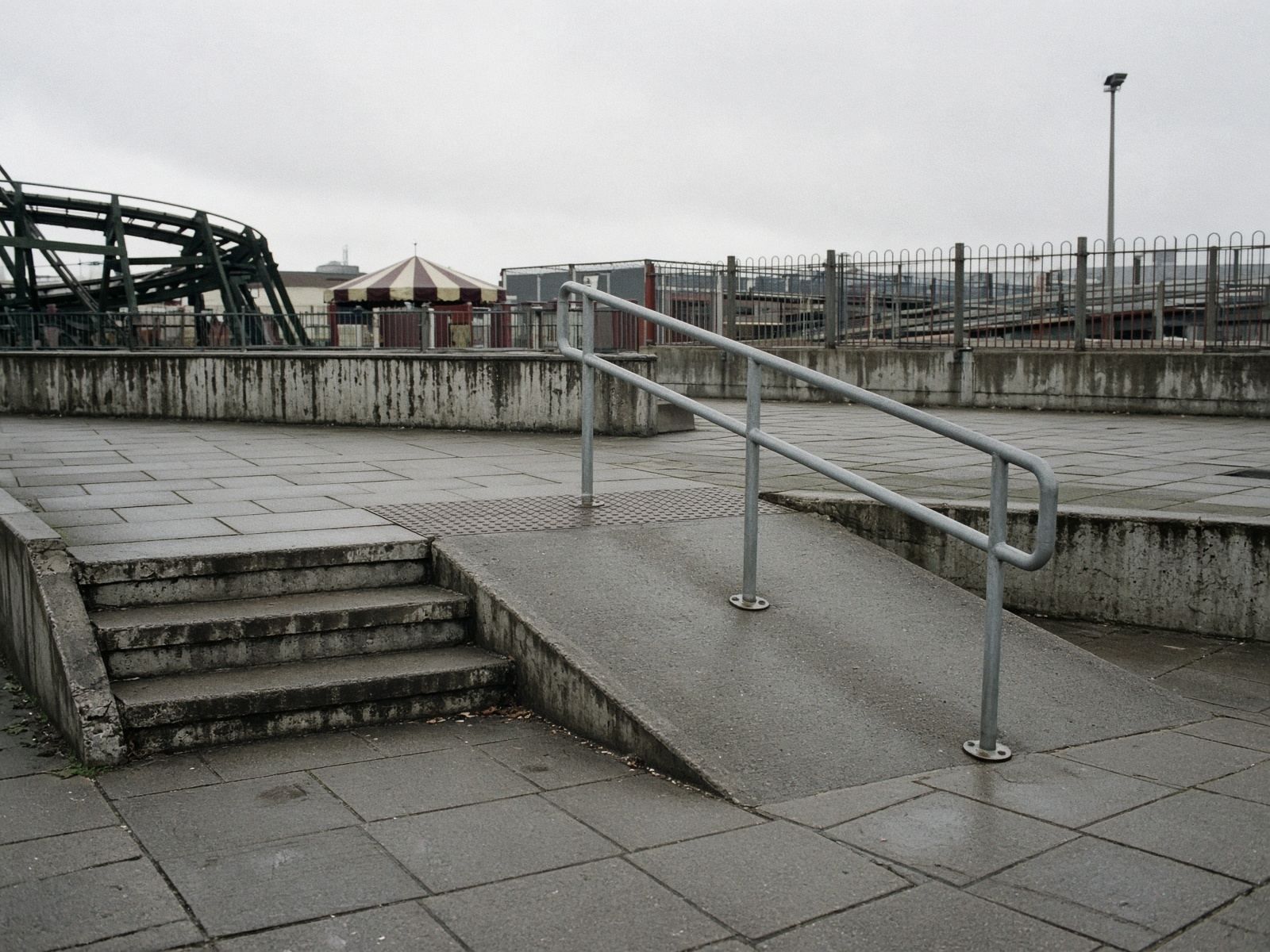 Steps and a ramp side by side at a park entrance